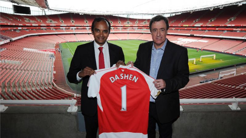 Dashen Beer and Arsenal FC representatives present a signed shirt at Emirates Stadium for the Dashen Football Challenge