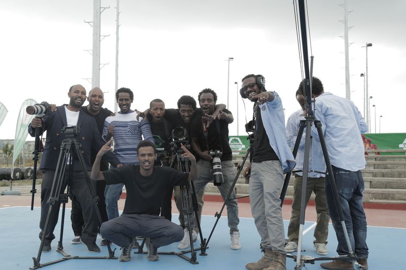 Film Ethiopia crew group portrait with cinema cameras and tripods on location in Ethiopia