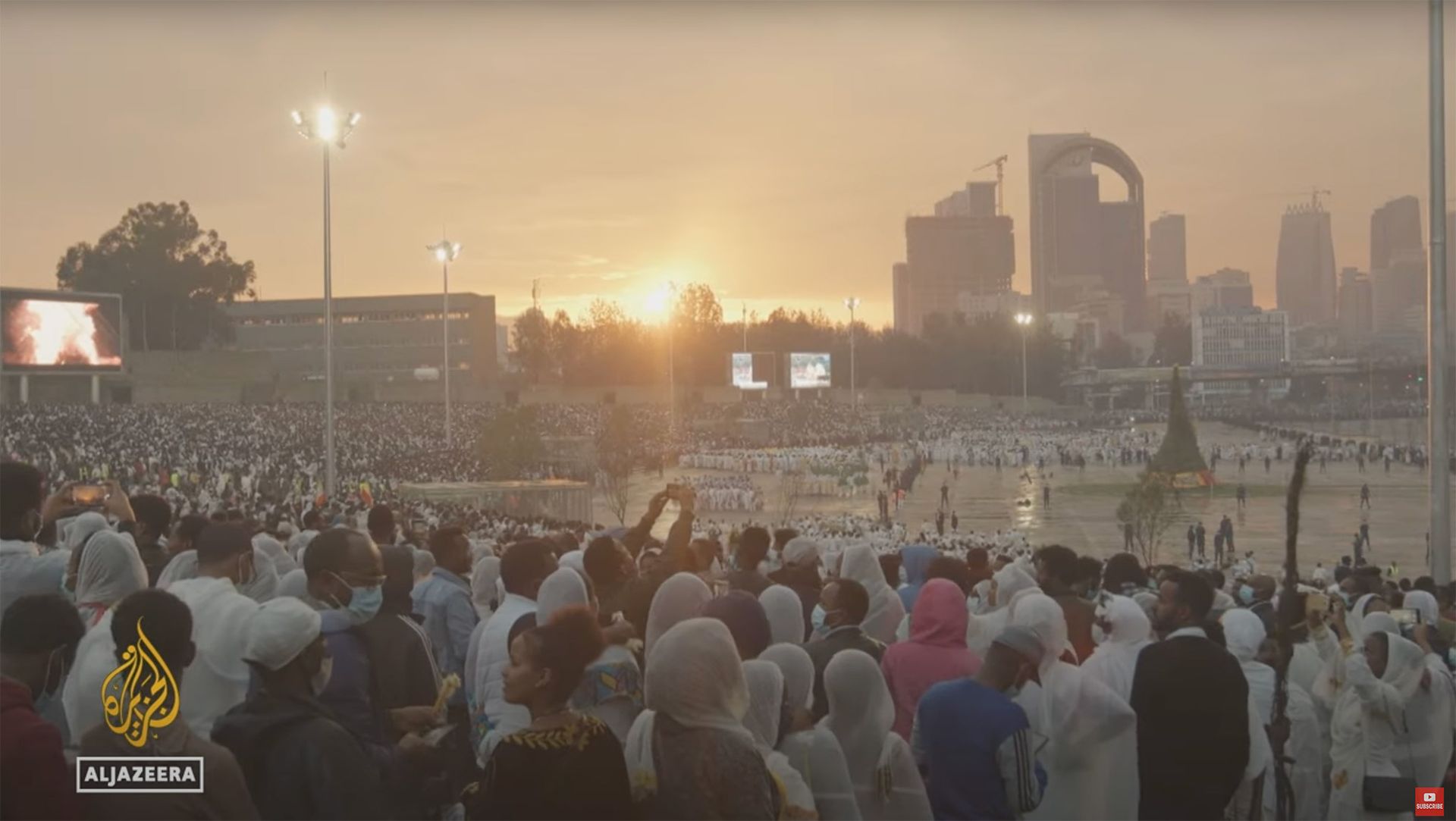 Thousands gather at dusk against the Addis Ababa skyline during filming of the Al Jazeera documentary Azmari in Ethiopia