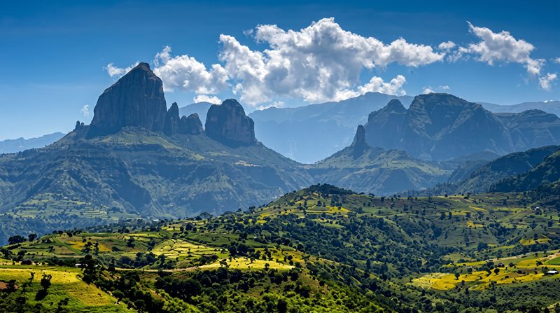 Eroded rock pinnacles and terraced farmland below the escarpment of the Simien Mountains in northern Ethiopia